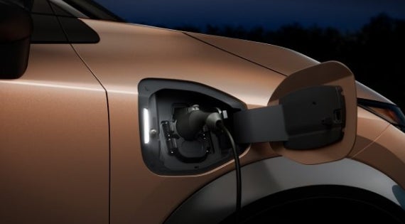 Close-up image of charging cable plugged in | Bennington Nissan in Bennington VT